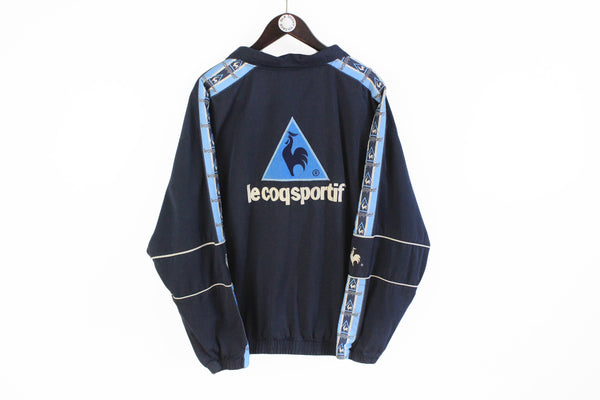 Vintage Le Coq Sportif Sweatshirt XLarge blue full sleeve logo collared v-neck jumper