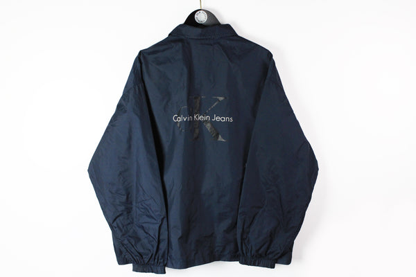Vintage Calvin Klein Jeans Jacket Large / XLarge big logo navy blue 90s classic windbreaker jacket made in Hong Kong